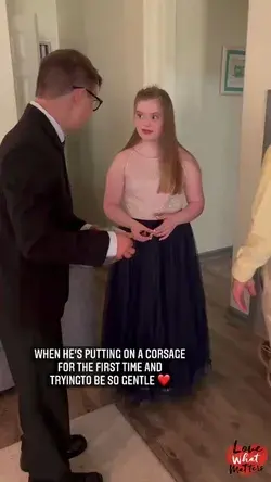 Young Boy With Down Syndrome Gives His Date A Corsage