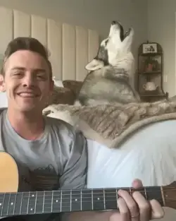 Dog and Dad singing together