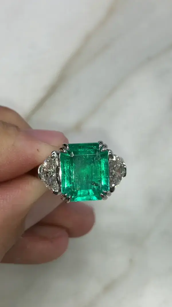 Colombian emerald and half moon diamond three stone engagement ring Platinum