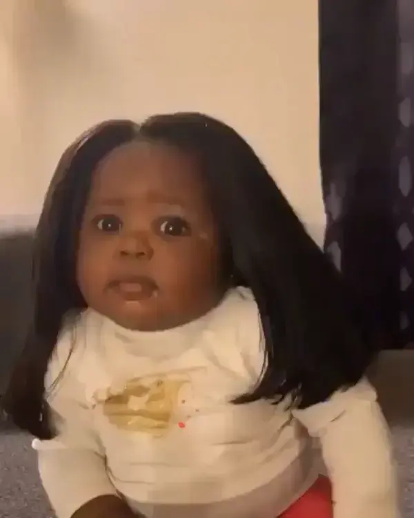 Adorable baby rocks a wig!